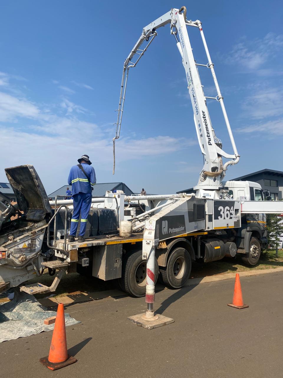 Bhekuza construction team operating concrete equipment on site